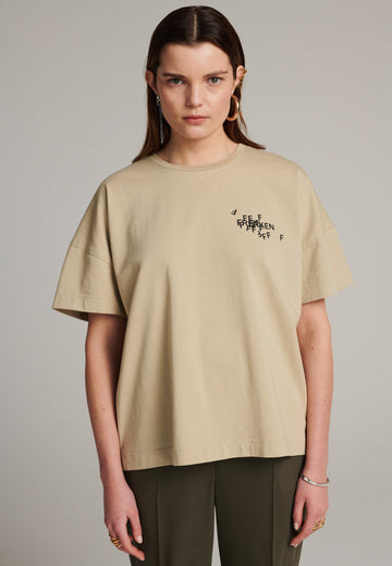 CUT jersey T-Shirt with cracked stamped logo beige. Cut for an oversized fit.