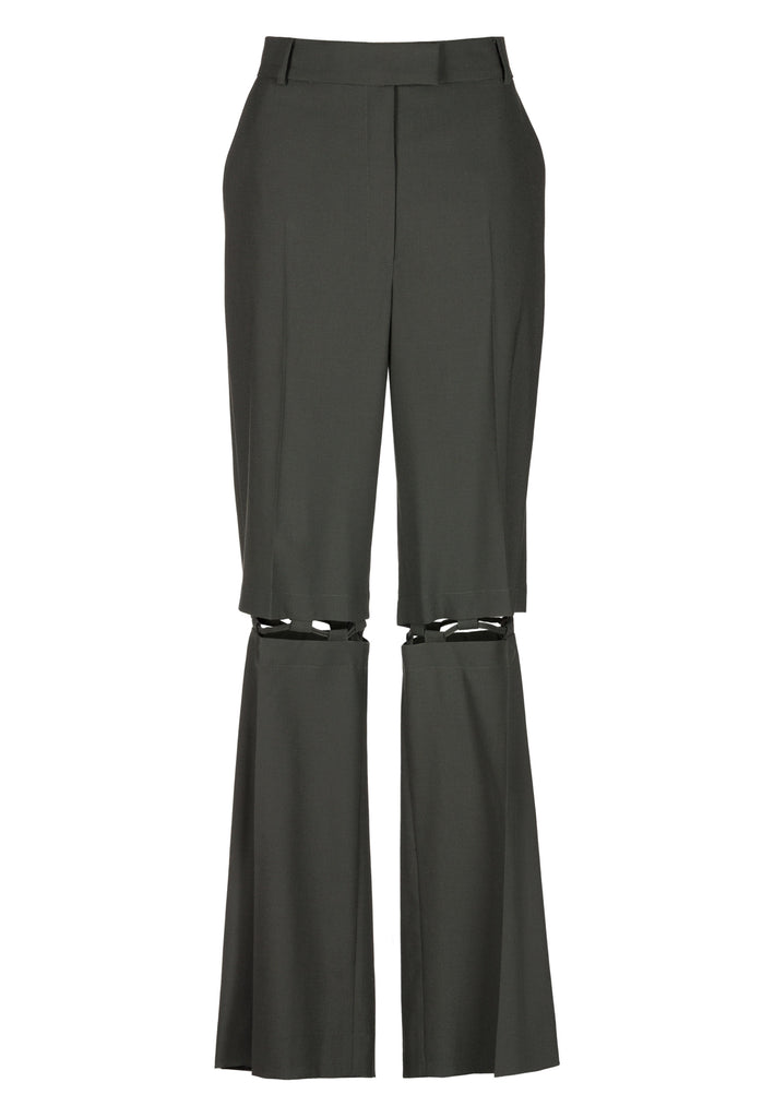 Boyish fitted straight leg trousers cut from fine light wool in black green. Detailed with a cut-out section right below the knee, held to the upper panels by a finely laced string. Can be worn elegantly open, loose or tied together.