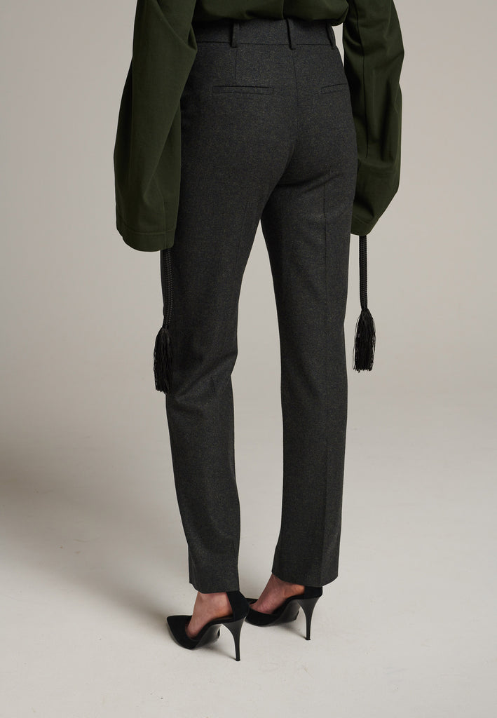 Mid-rise straight-leg pants that create a sleek silhouette. Made from a soft wool blend in back green with back welt pockets. Menswear-inspired tailored waistband. Pressed front pleat that elongates the leg for a sophisticated fitting.