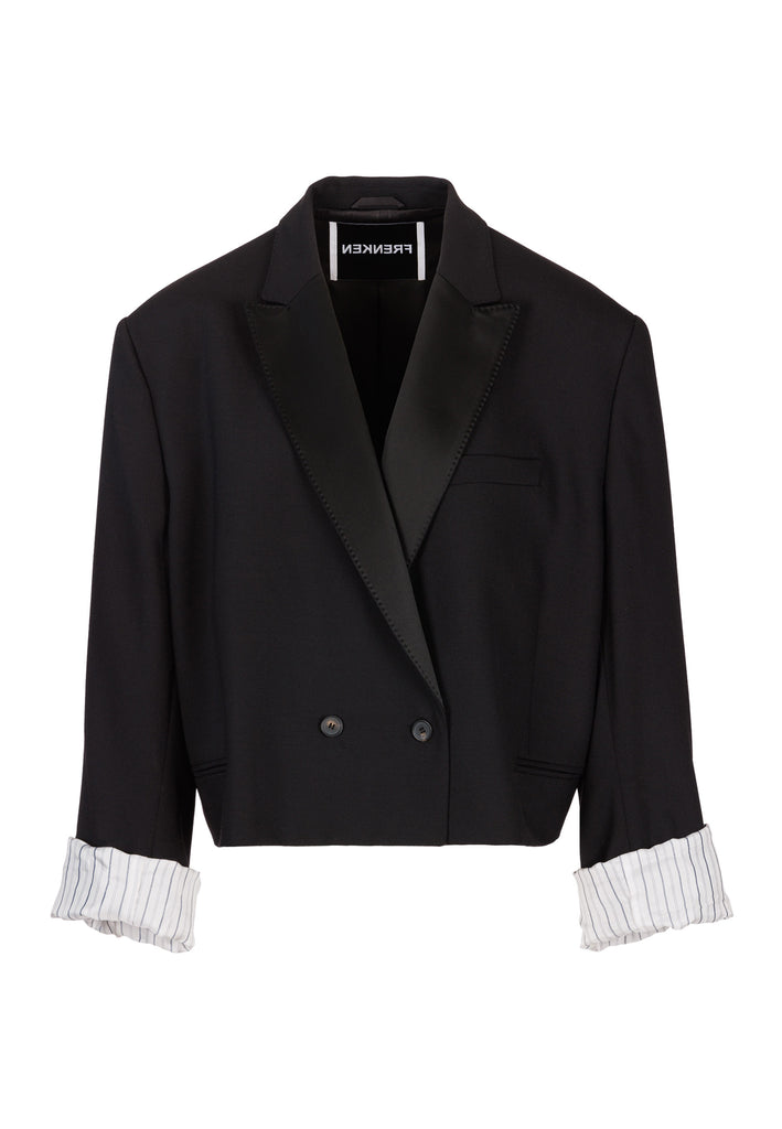 Menswear-inspired smoking blazer with satin lapel, horn buttons, pockets, and shoulder pads for an extreme oversized fitting. The exaggerated long sleeves can be rolled up to reveal a contrasting striped lining. Cut from a fine wool blend, its cropped shape adds a sophisticated touch.
