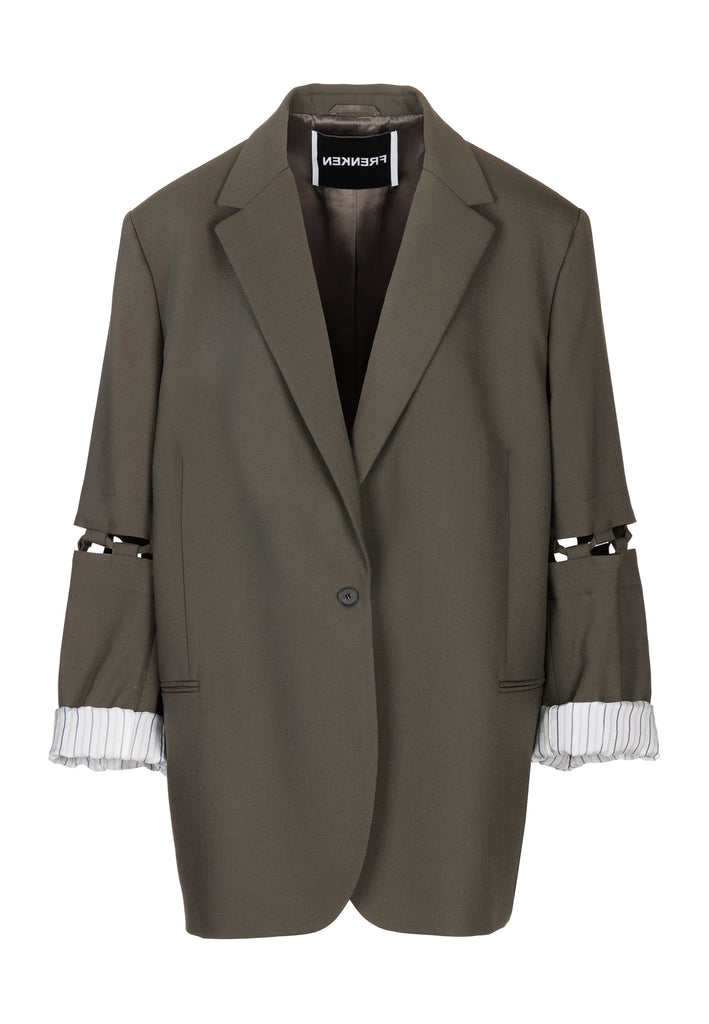 Menswear-inspired smoking blazer in dark camel with horn buttons and shoulder pads, emphasizing the oversized fitting. The exaggerated long sleeves can be rolled up to reveal a striped lining. The blazer features a cut-out section around the elbow, making a two-piece sleeve held together by a finely laced string. Can be worn elegantly open, loose or tied together.