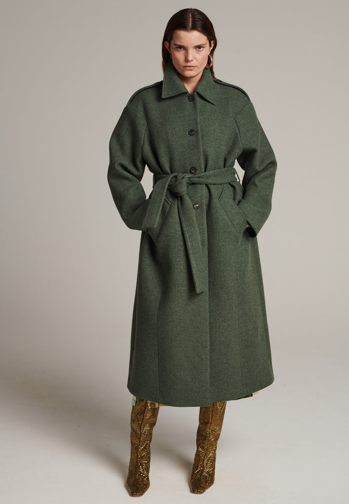 Oversized relaxed-fit coat in green melange cut from a recycled soft wool blend, fully lined with satin. It comes with a coordinating belt to temper the loose fit and to cinch to the waistline.