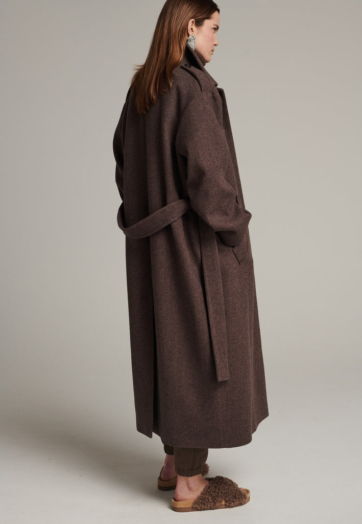 Oversized relaxed-fit coat in brown choco melange cut from a recycled soft wool blend, fully lined with satin. It comes with a coordinating belt backed with with contrasting grosgrain tape, to temper the loose fit and to cinch to the waistline.
