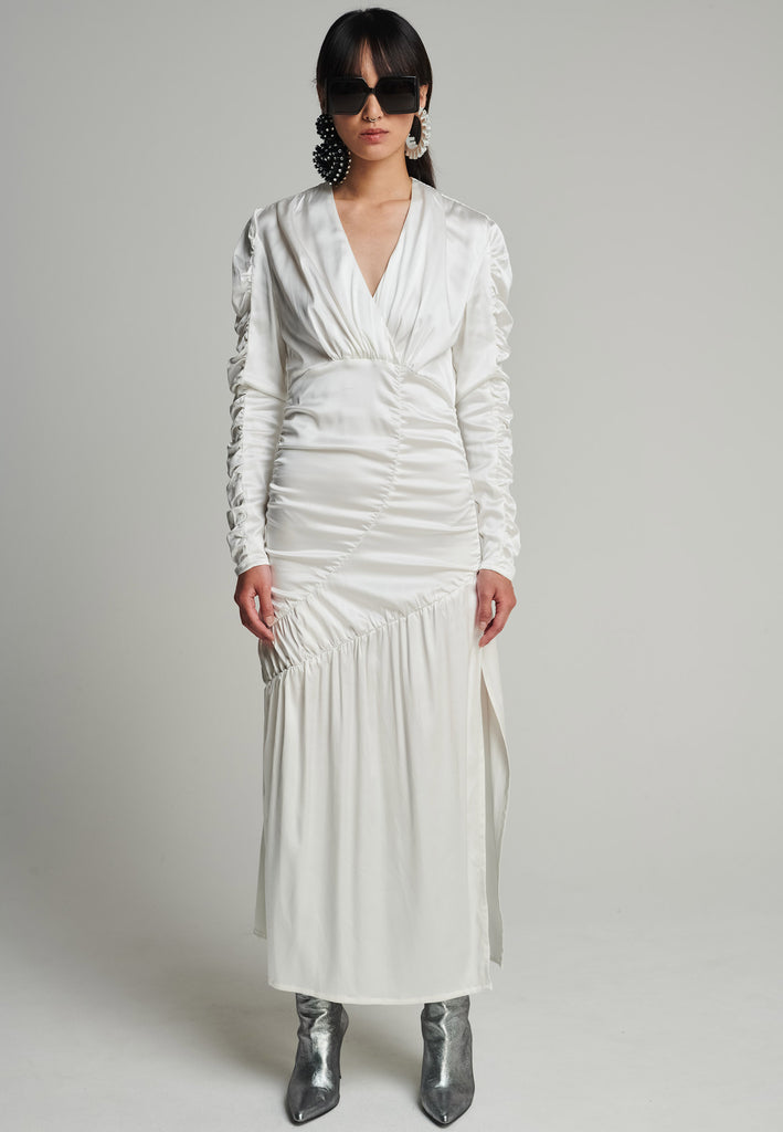 Satin midi dress in off-white. Features a v-neck, wrinkled-style hip and arms, and leg opening. True to size.