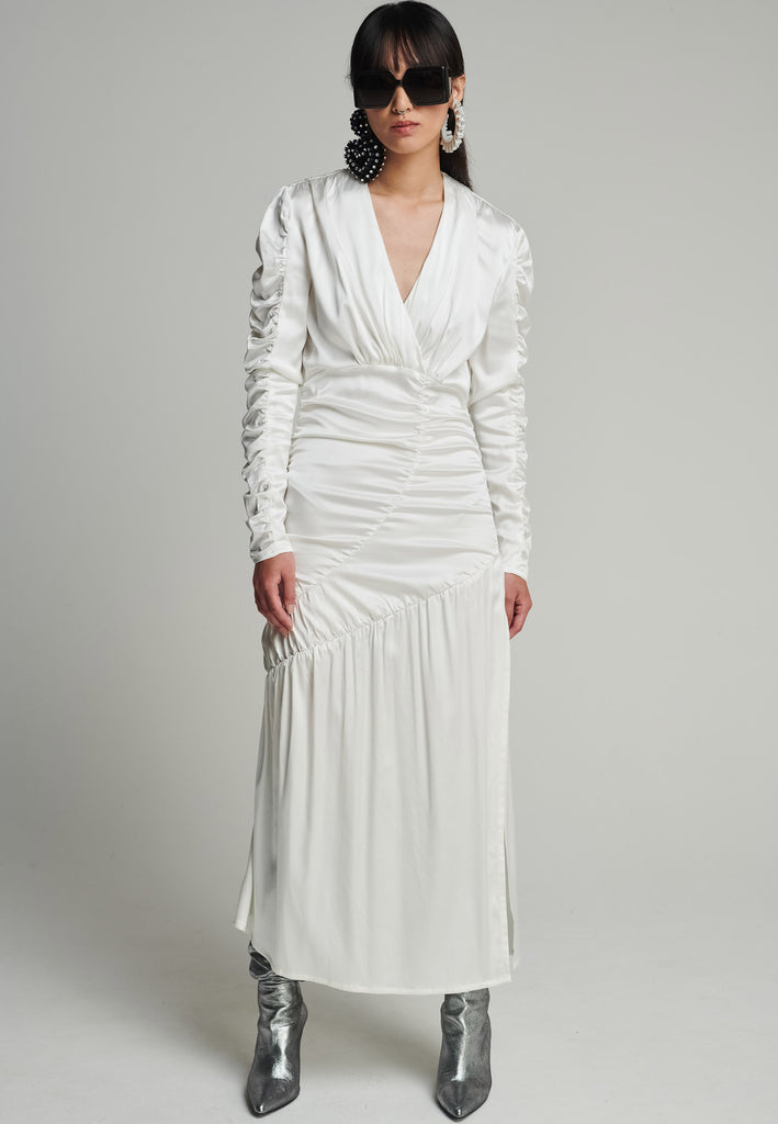Satin midi dress in off-white. Features a v-neck, wrinkled-style hip and arms, and leg opening. True to size.