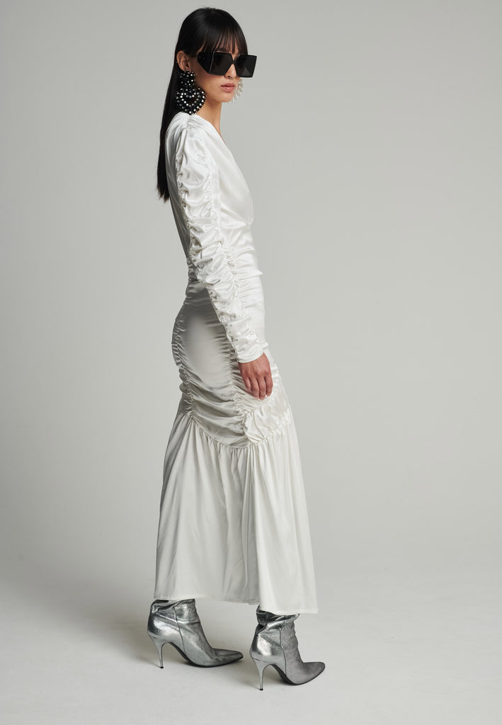 Satin midi dress in off-white. Features a v-neck, wrinkled-style hip and arms, and leg opening. True to size.