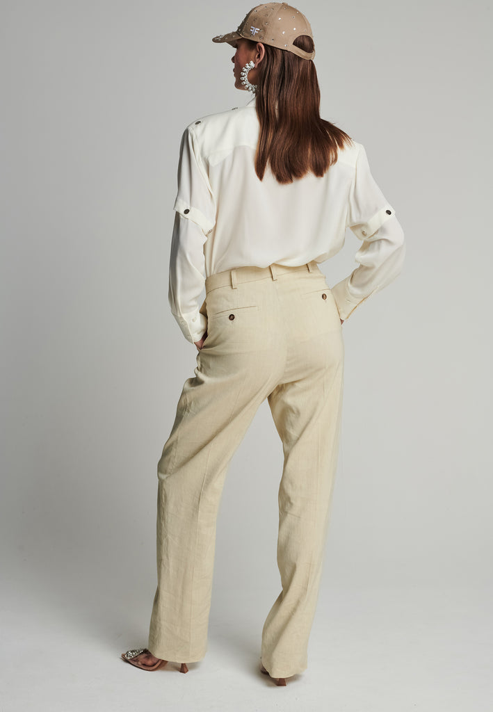 Wide-leg pants in stone. Features pockets, belt loops, and pressed front pleats. True to size.