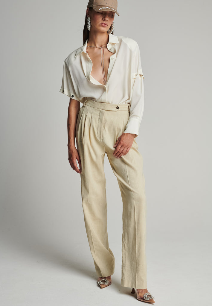 Wide-leg pants in stone. Features pockets, belt loops, and pressed front pleats. True to size.