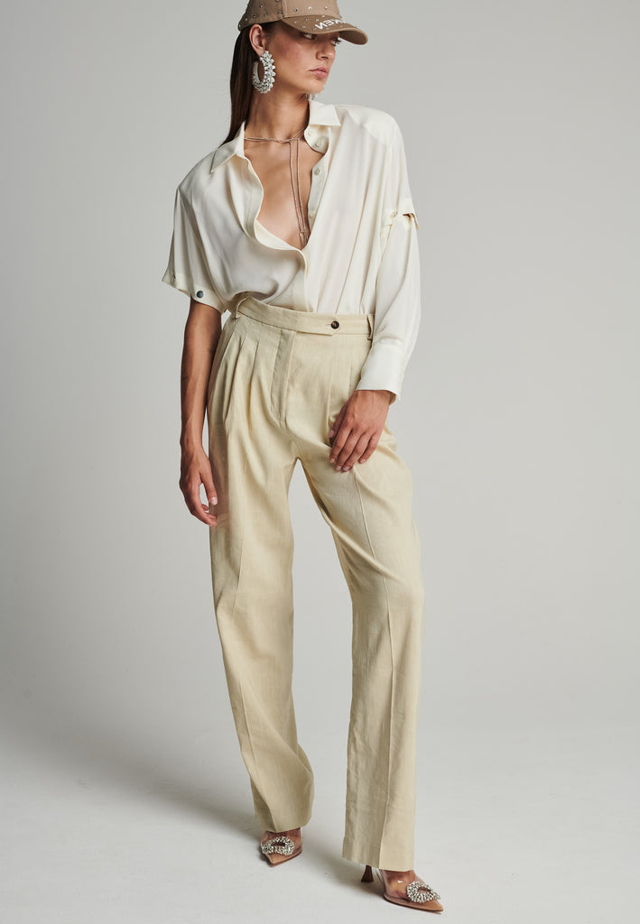 Wide-leg pants in stone. Features pockets, belt loops, and pressed front pleats. True to size.