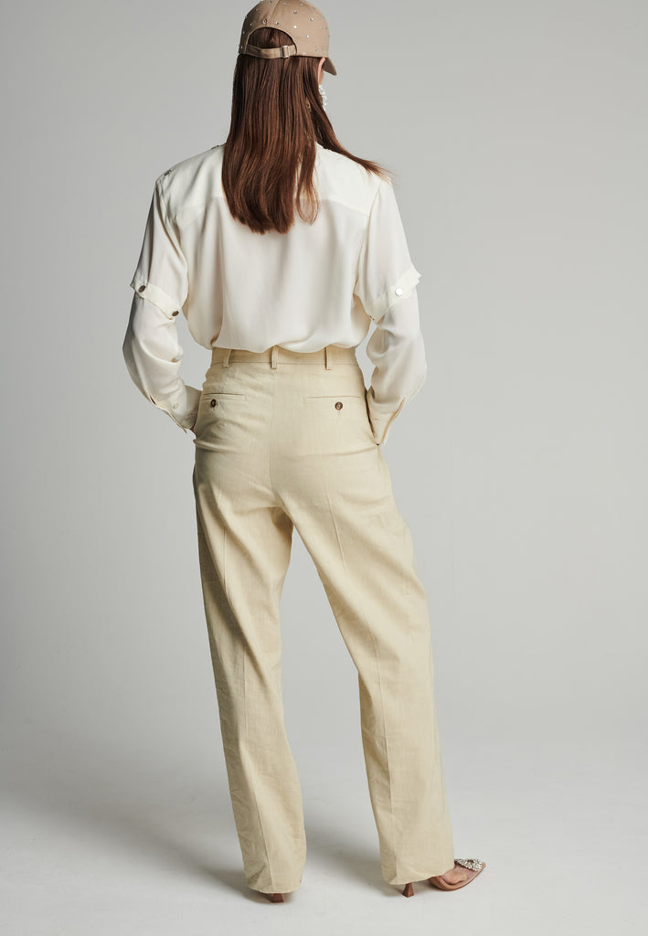 Wide-leg pants in stone. Features pockets, belt loops, and pressed front pleats. True to size.
