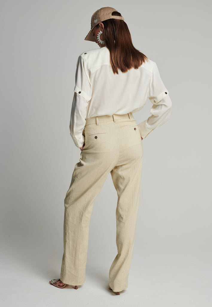 Wide-leg pants in stone. Features pockets, belt loops, and pressed front pleats. True to size.