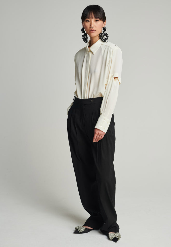 Wide-leg pants in black. Features pockets, belt loops, and pressed front pleats. True to size.