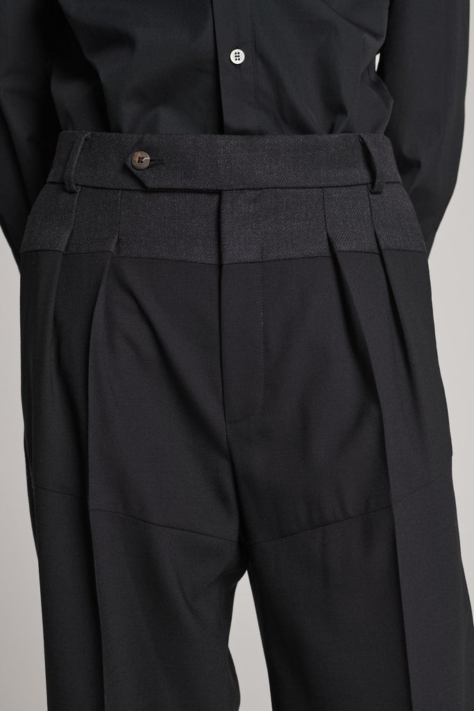 Straight pants that combine two classic wool fabrics. Features pockets, belt loops, and pressed creases. True to size.
