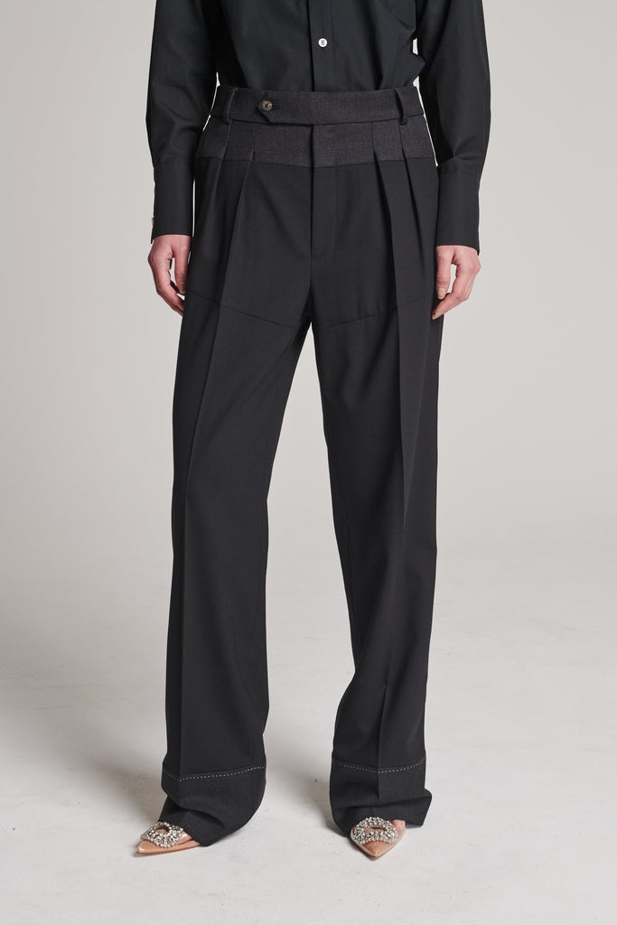 Straight pants that combine two classic wool fabrics. Features pockets, belt loops, and pressed creases. True to size.