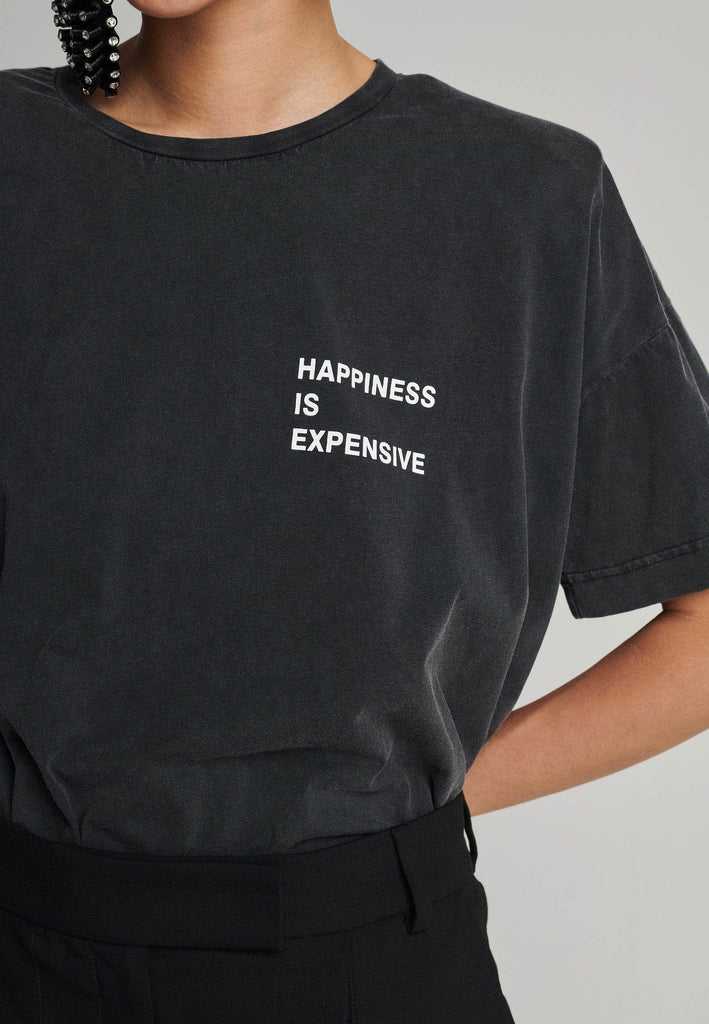 Cotton t-shirt in black. Features a crack-print with the phrase "Happiness is expensive". True to size.