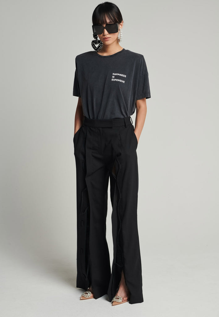 Cotton t-shirt in black. Features a crack-print with the phrase "Happiness is expensive". True to size.