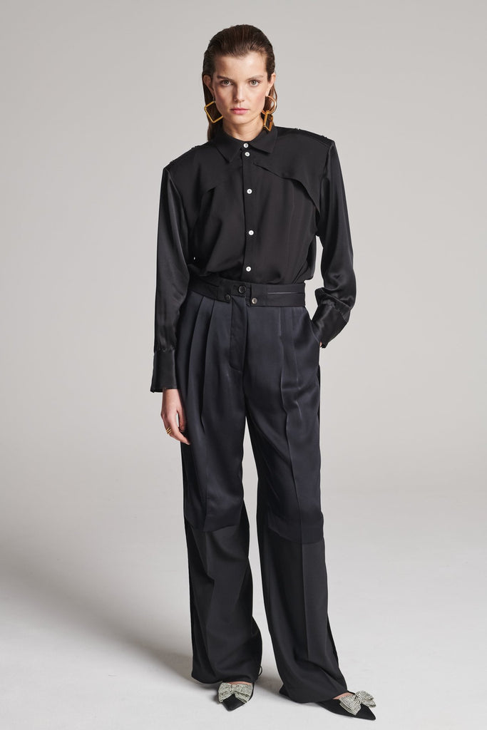 Wide-leg pants with insideout details. Features pockets, fully lined top and pressed creases. Fits oversized.