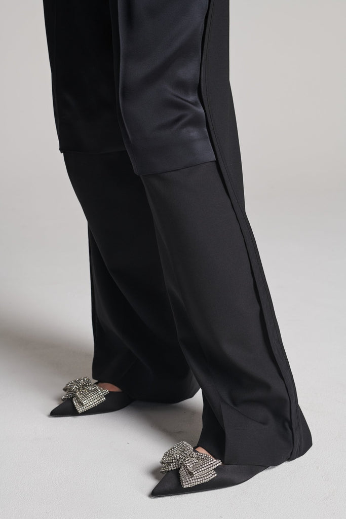 Wide-leg pants with insideout details. Features pockets, fully lined top and pressed creases. Fits oversized.
