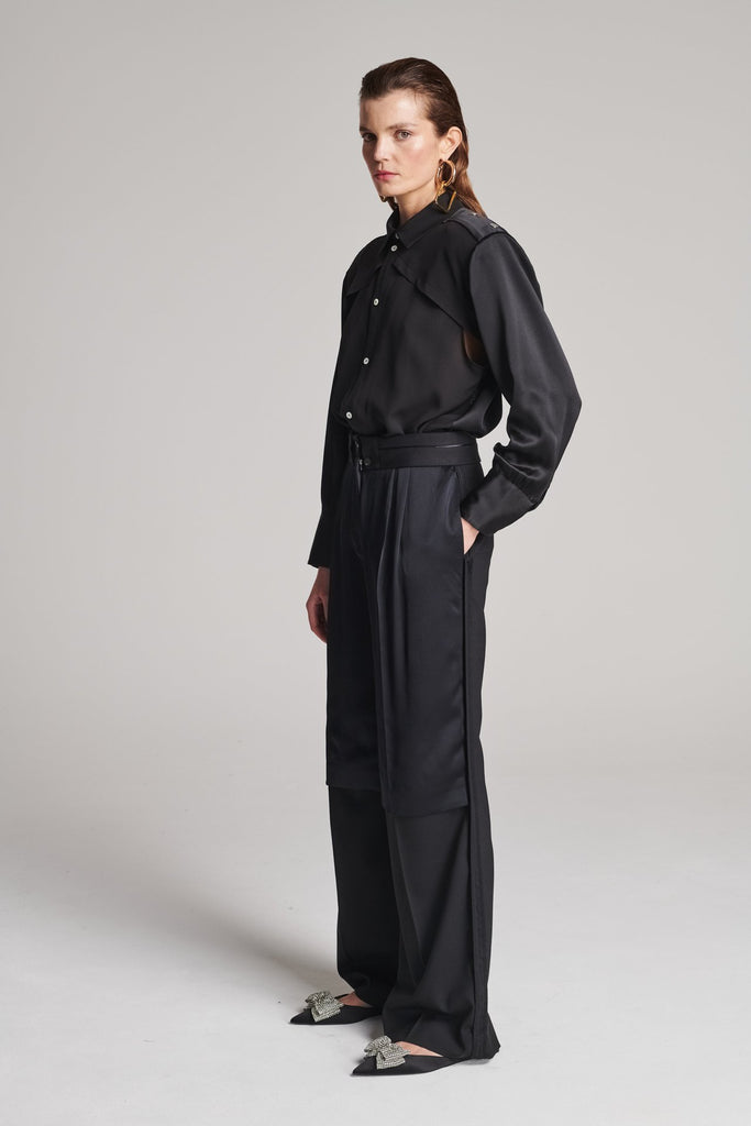 Wide-leg pants with insideout details. Features pockets, fully lined top and pressed creases. Fits oversized.