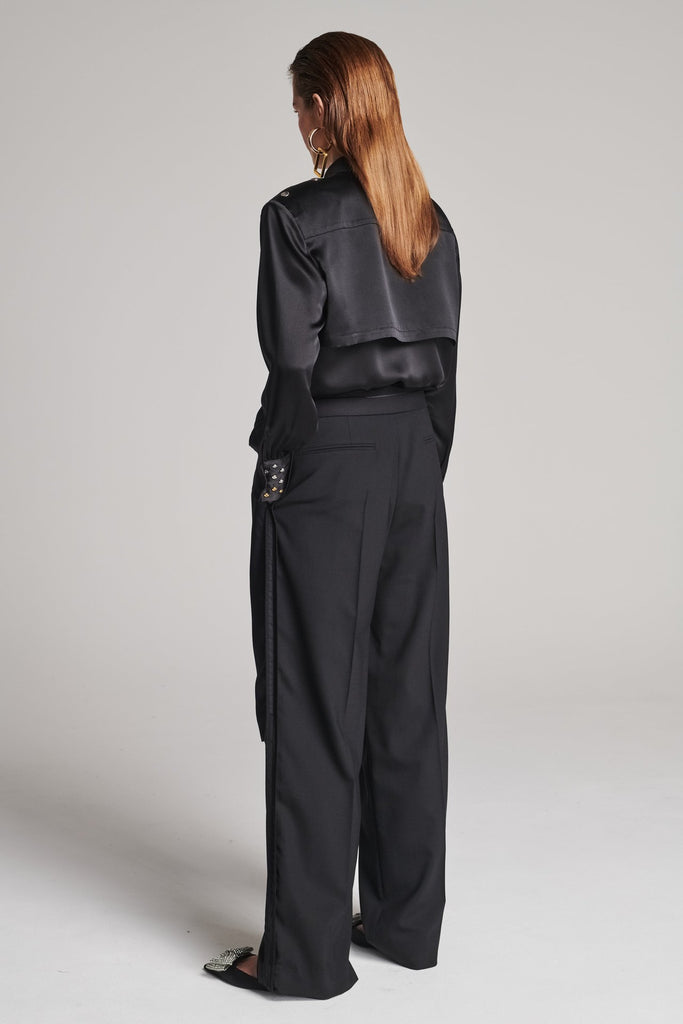 Wide-leg pants with insideout details. Features pockets, fully lined top and pressed creases. Fits oversized.