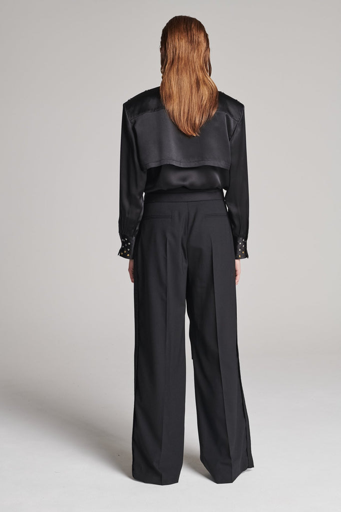 Wide-leg pants with insideout details. Features pockets, fully lined top and pressed creases. Fits oversized.