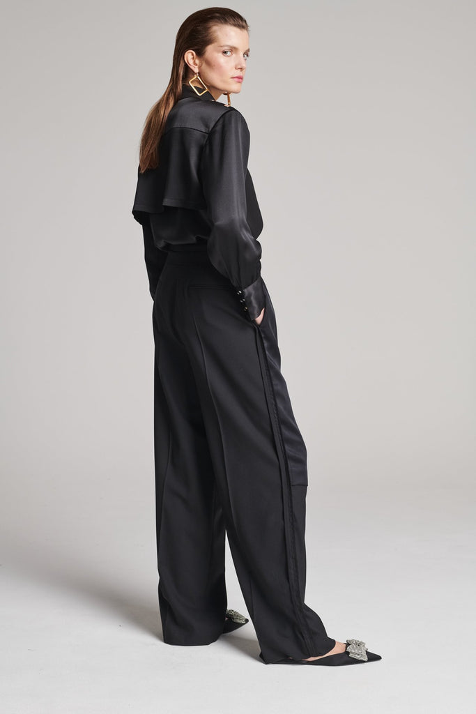 Wide-leg pants with insideout details. Features pockets, fully lined top and pressed creases. Fits oversized.