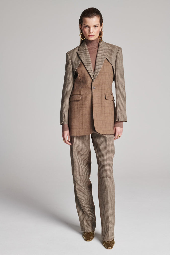 Shoulder-padded fitted blazer. Cut from the finest checked suiting wool blend. Features two checked fabrics miraculosly combined in one design. Detailed with a check double layer at the front top panel and back. True to size.
