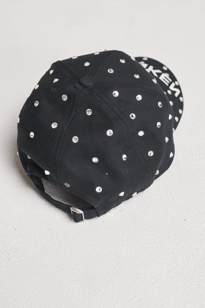 Cap accessory spiced-up with sprinkled dazzling Swarovski diamonds. Features stamped FRENKEN logo. Adjustable on the back.
