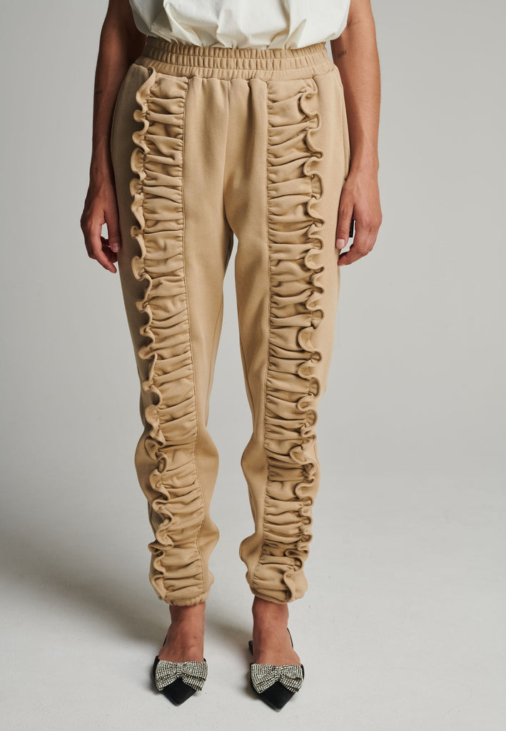 Ruffled sweatpants in camel. Features an crinkled effect, and elastic waistband and ankle cuffs. True to size.