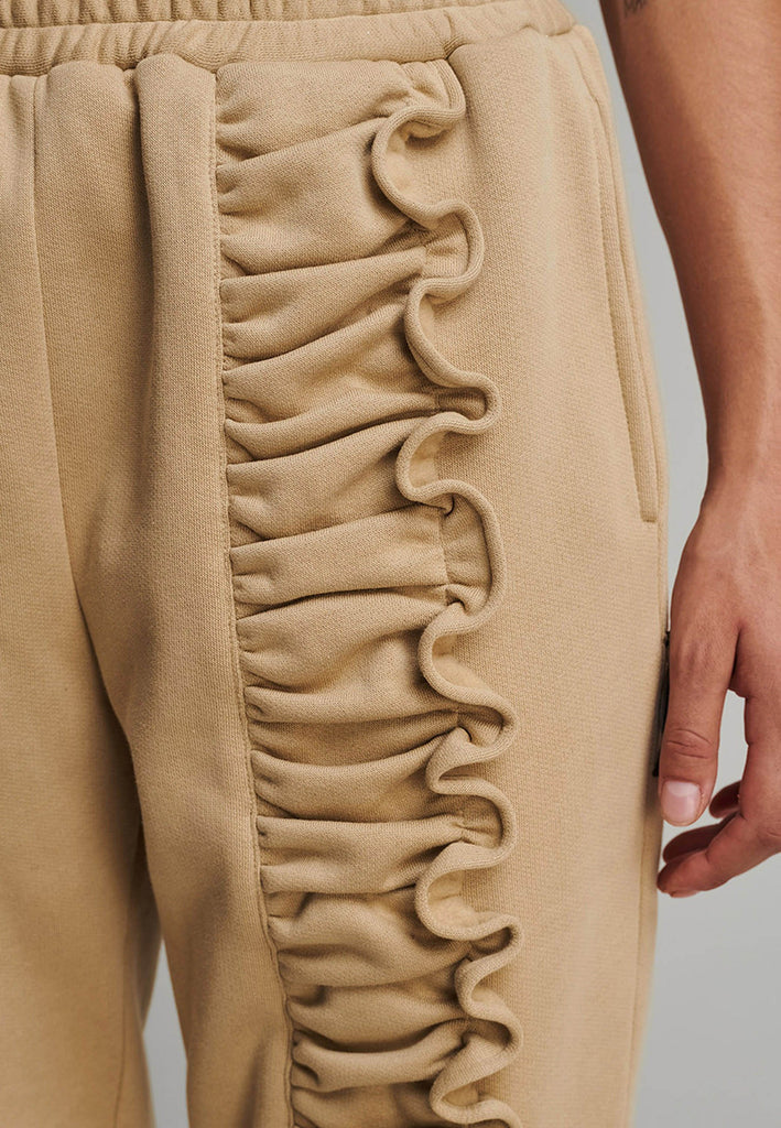 Ruffled sweatpants in camel. Features an crinkled effect, and elastic waistband and ankle cuffs. True to size.