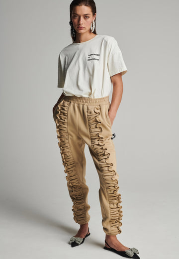 Ruffled sweatpants in camel. Features an crinkled effect, and elastic waistband and ankle cuffs. True to size.