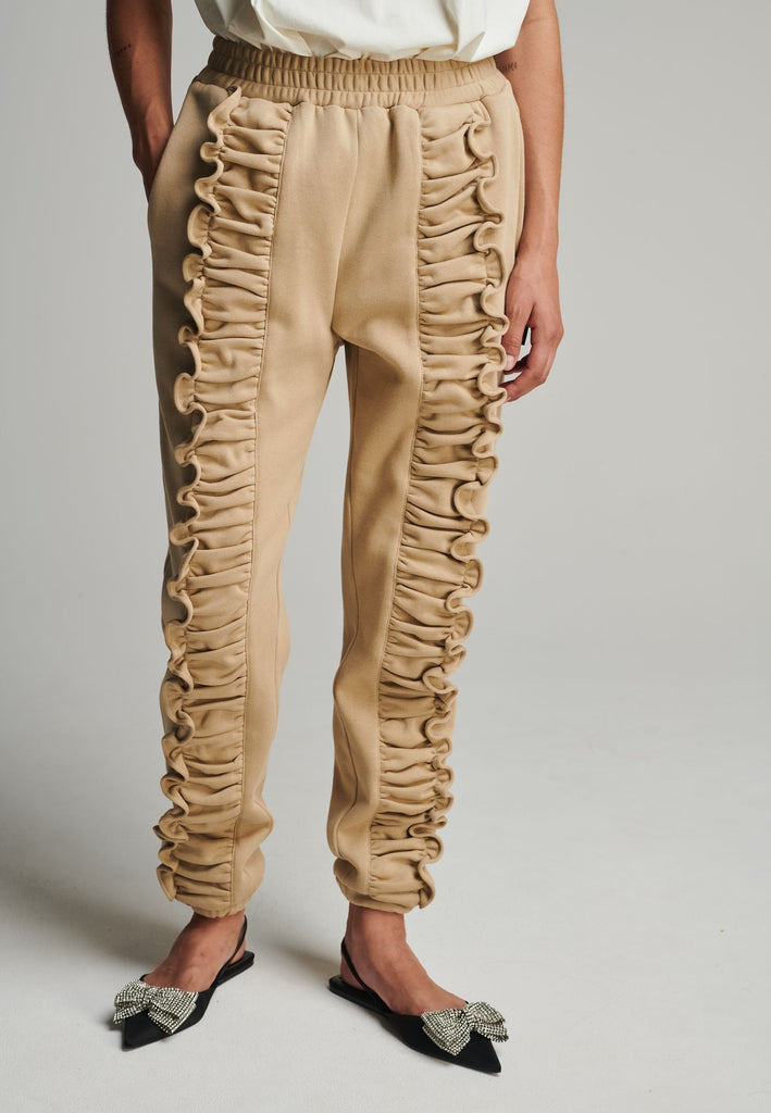 Ruffled sweatpants in camel. Features an crinkled effect, and elastic waistband and ankle cuffs. True to size.