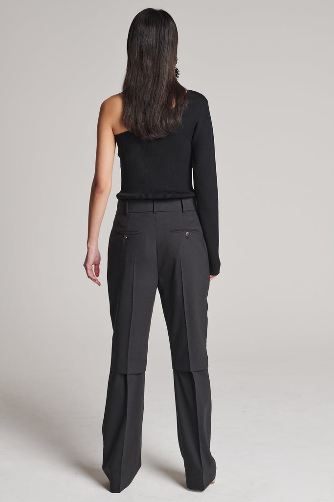 Straight pants with an over-layer effect. Features pockets, belt loops and pressed creases. True to size.