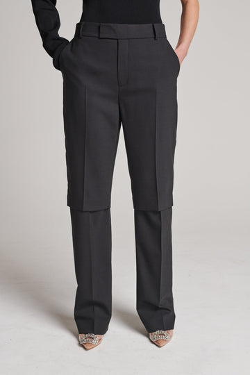 Straight pants with an over-layer effect. Features pockets, belt loops and pressed creases. True to size.