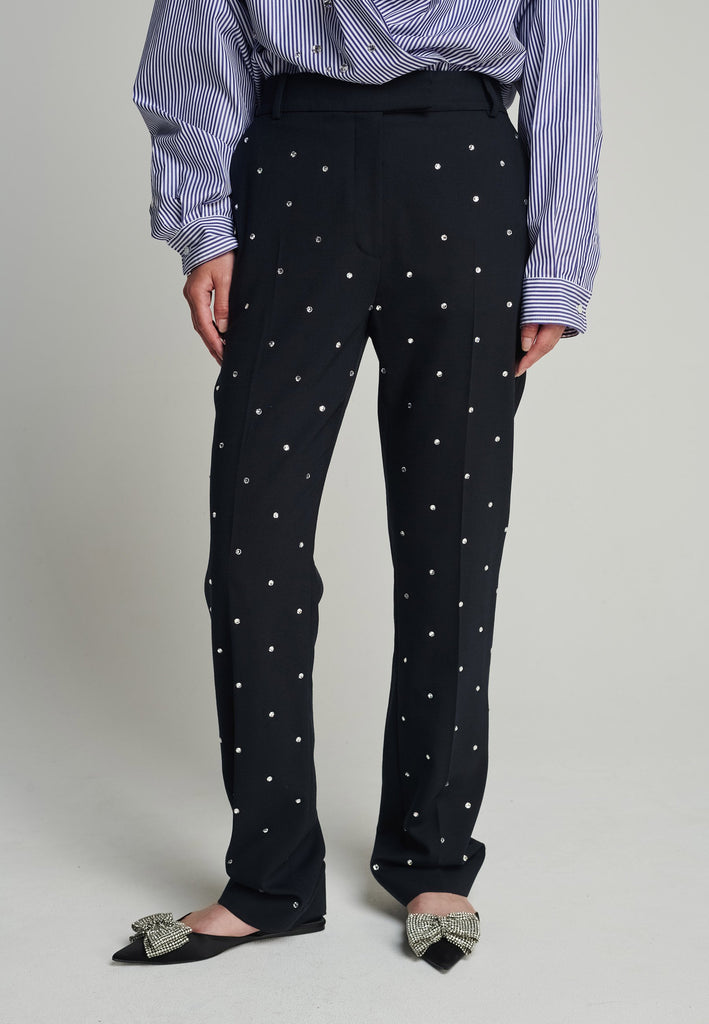 Regular pants in navy. Features sprinkled Swarovski diamonds, pockes, belt loops, and pressed front crease. True to size.