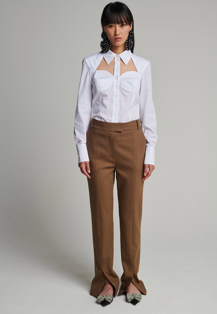 Slim pants in camel. Features pockets, belt loops, pressed front pleats, and na ankle opening. True to size.