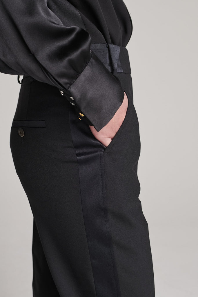 Straight pants with a satin band at the side seam and waistband. Features satin pockets, belt loops and pressed creases. True to size.