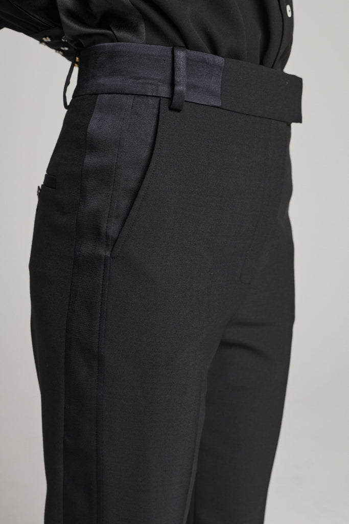 Straight pants with a satin band at the side seam and waistband. Features satin pockets, belt loops and pressed creases. True to size.