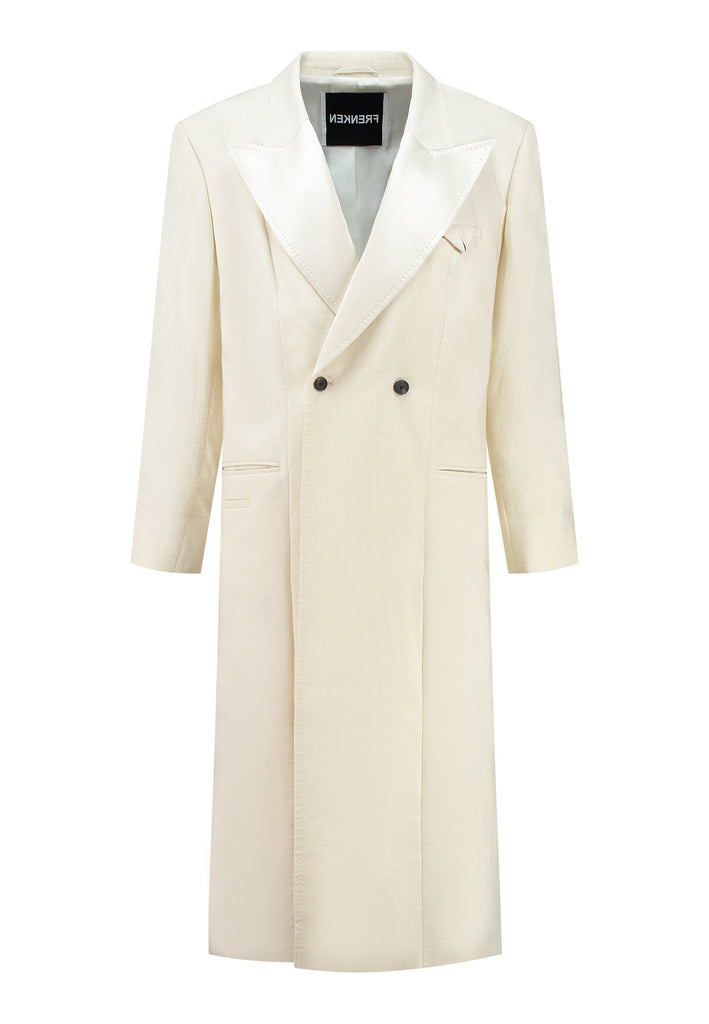 An effortless coat to slip over any outfit, the LONG coat is made from a linen blend with a wrinkle-washed look. Detailed by sharp shoulder pads, double-breast fitting, square hole horn buttons and satin lapel finish with needle stitching. The ankle-grazing length emphasizes the loose fit and the effortless cool over tailoring. FRENKEN makes dressing up every morning easier.