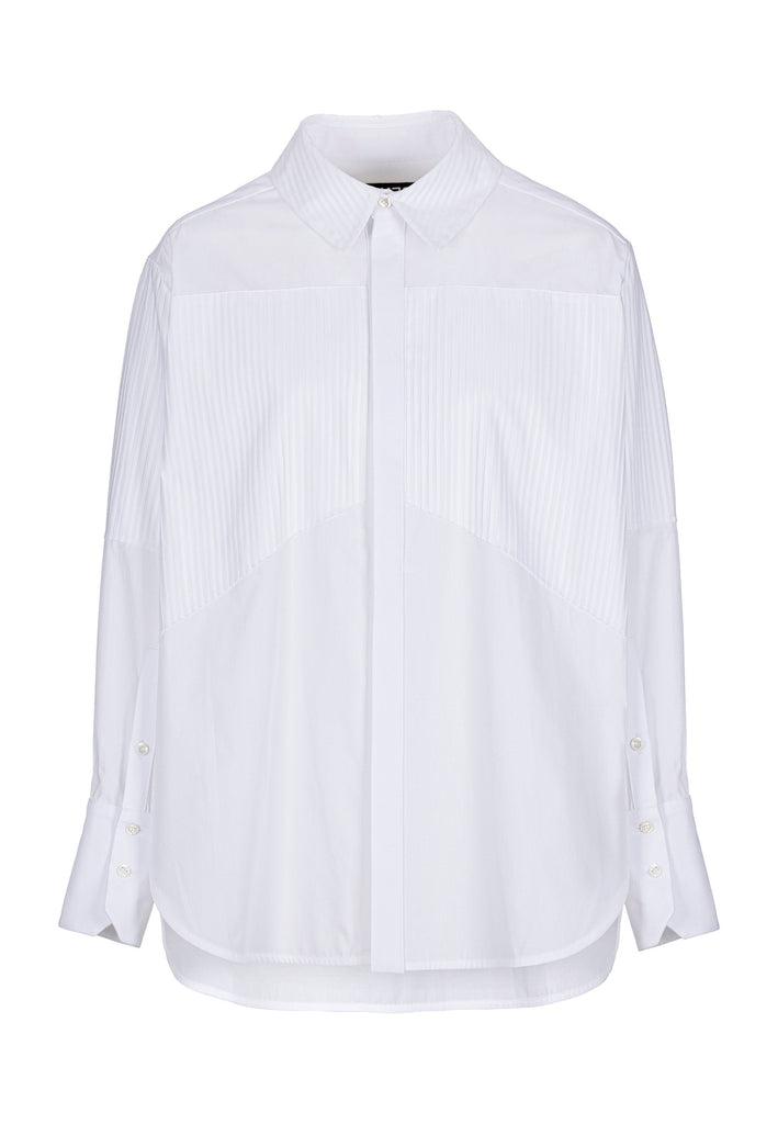 Menswear-inspired shirt. Features plisse details at the top front panel and back. Detailed with a classic collar stand, a concealed button fly-front and a string belt to adjust to your liking. Fits oversize.