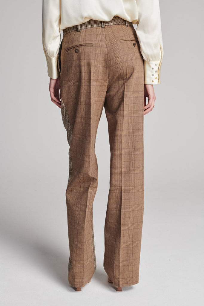 Straight pants that combine two grandpa-inspired check-suiting fabrics. Features pockets, belt loops, and pressed creases. True to size.