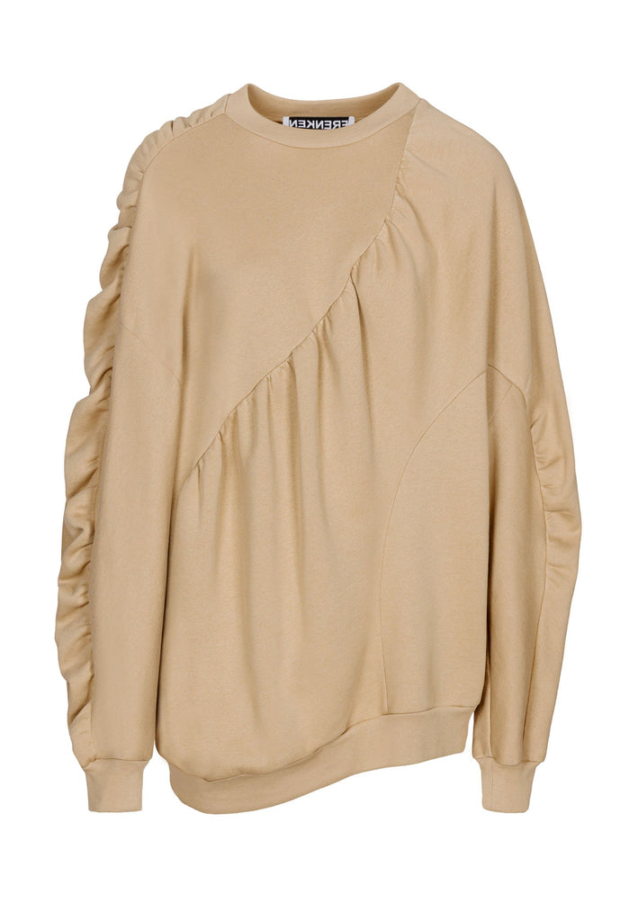 Cotton batwing sleeve sweater in camel. Features na wrinkled effect, and elastic cuffs. Fits oversize.