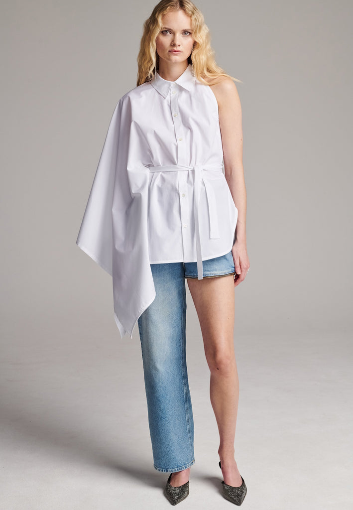 Our Square asymmetric shirt is an elegant choice for special events as well as your casual go-to. One shoulder big kimono sleeve, one detachable button-off sleeve. Designed for a relaxed/oversized fit. Use the tie belt to cinch in at the waist. Detailed with six-hole buttons. Cut from crispy 100% cotton poplin. Made in Lithuania.