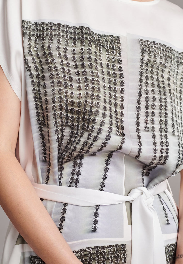 Maxi satin dress. Detailed with a digital print, side slits and a belt to cinch at the waist. 