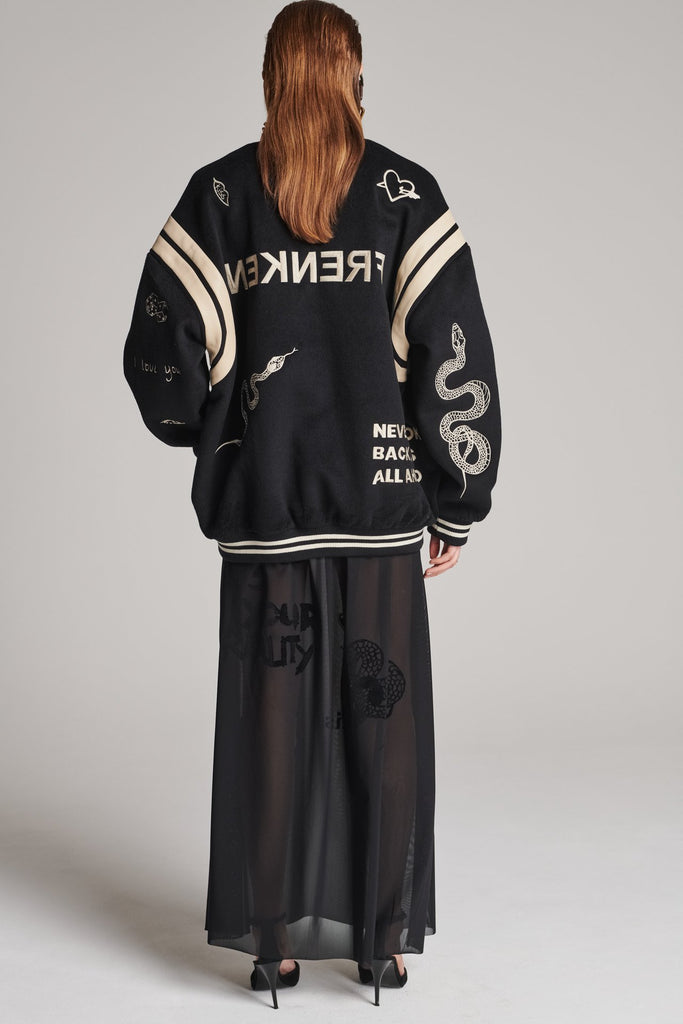 Wide-shouldered baseball jacket. Features unique designs all-over, stamped logo on the back, press buttons, leather shoulder straps, pockets, elasticated cuffs and waistband. Fits oversized.