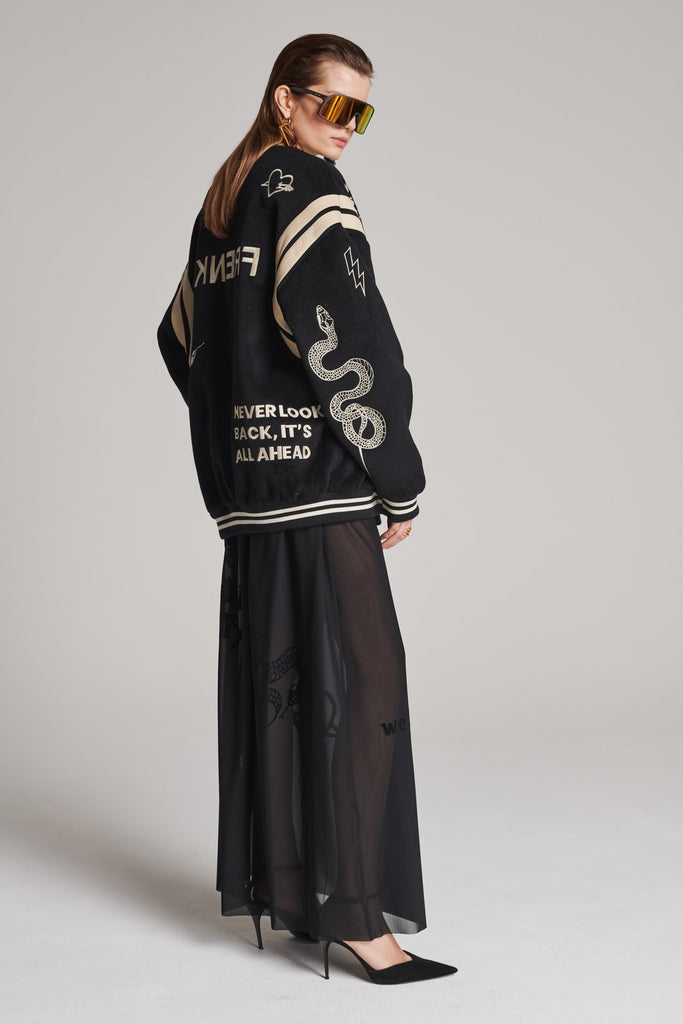 Wide-shouldered baseball jacket. Features unique designs all-over, stamped logo on the back, press buttons, leather shoulder straps, pockets, elasticated cuffs and waistband. Fits oversized.