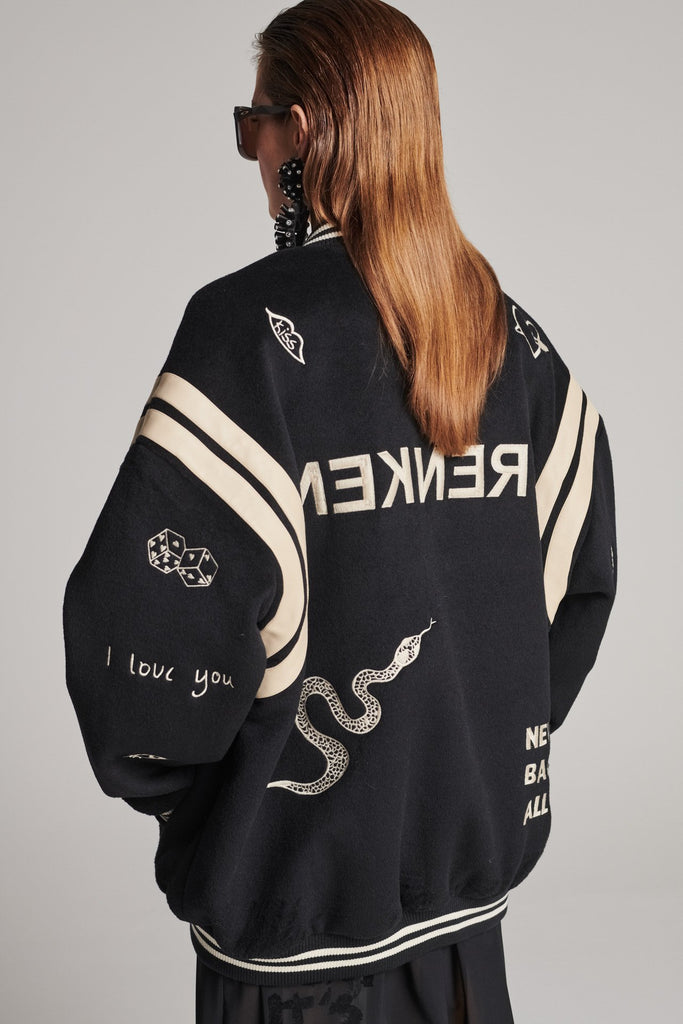 Wide-shouldered baseball jacket. Features unique designs all-over, stamped logo on the back, press buttons, leather shoulder straps, pockets, elasticated cuffs and waistband. Fits oversized.