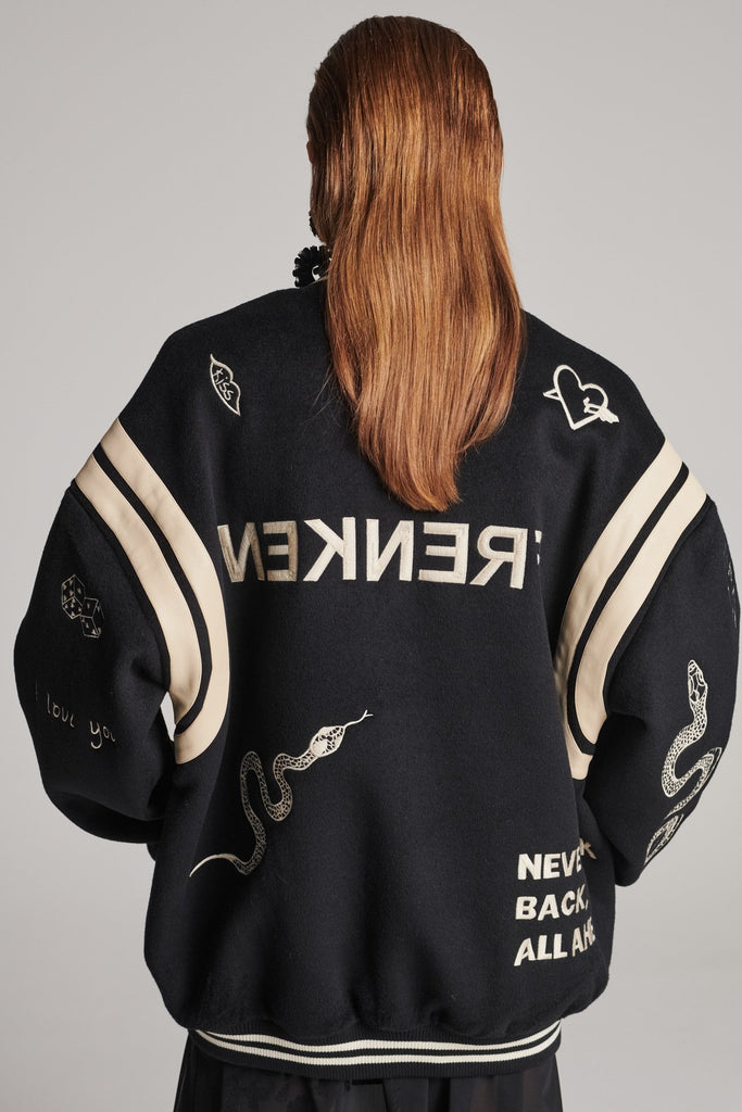 Wide-shouldered baseball jacket. Features unique designs all-over, stamped logo on the back, press buttons, leather shoulder straps, pockets, elasticated cuffs and waistband. Fits oversized.