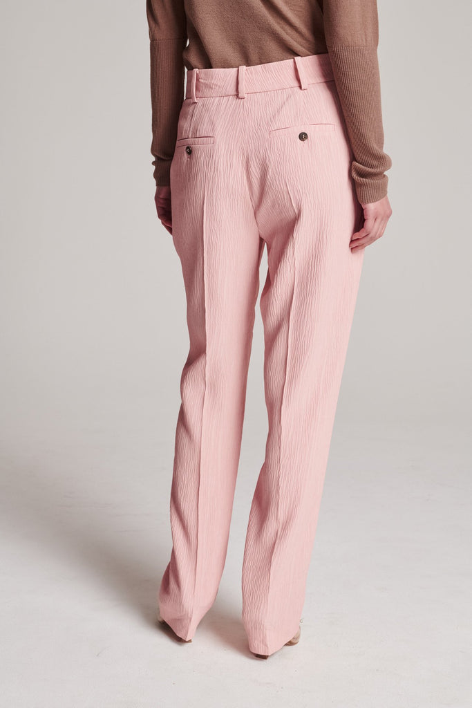 Straight pants, fluid and loose for complete comfort. Features plisse details softly pressed creases, belt loops, buttons, and side and back pockets. True to size.