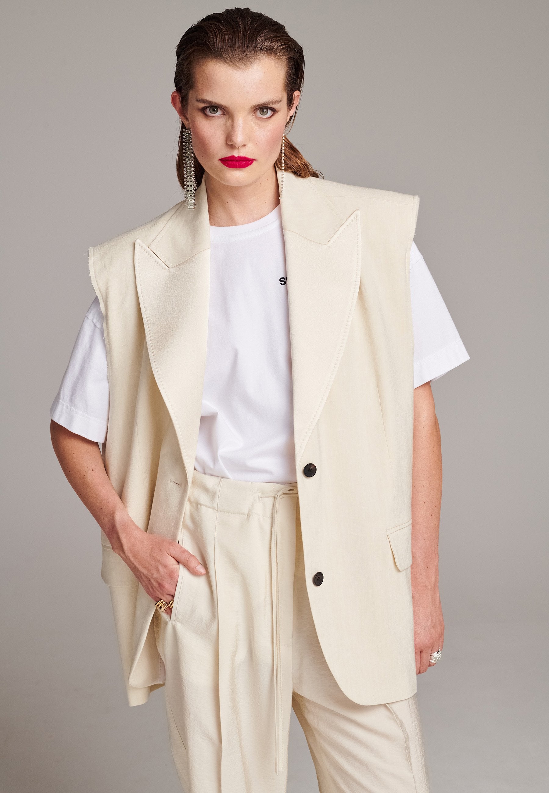Cream sleeveless blazer top